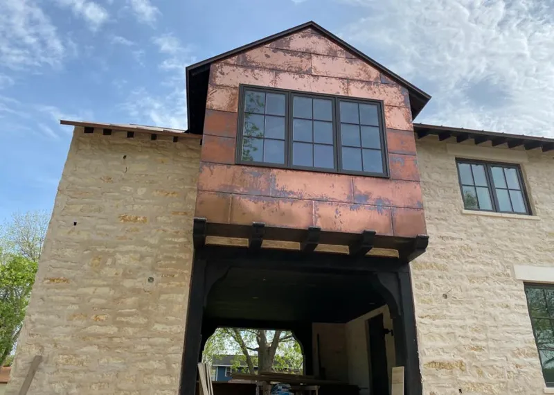 Copper metal panel facade on a stone building for Metal Roof Coating in Pleasant Hill